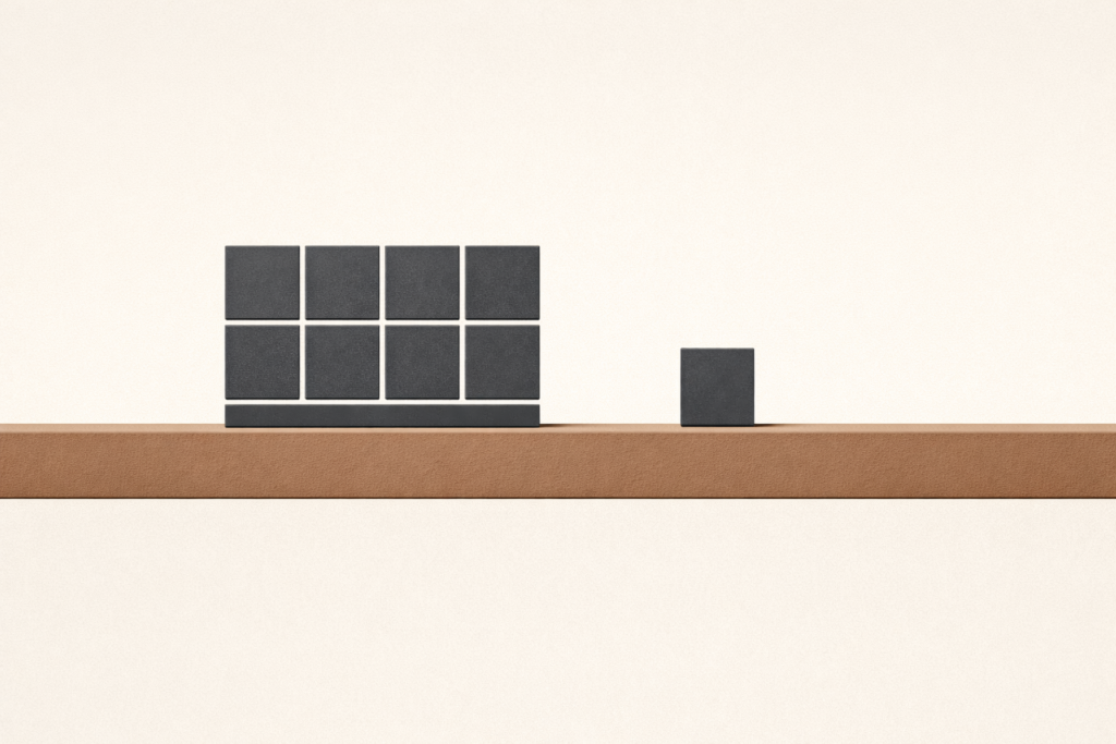 Disciplined surrender illustration with one charcoal block resting on a clay-brown beam while remaining blocks form a grid above, symbolizing release of outcomes.