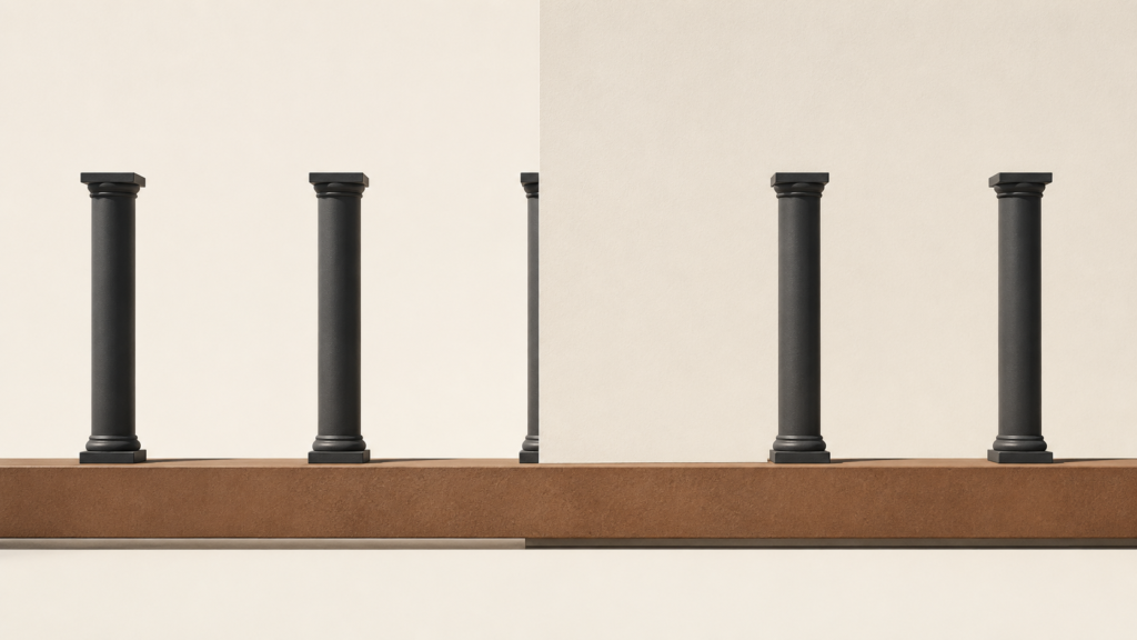 Minimalist architectural columns with one partially hidden behind a sand-colored wall, symbolizing unanswered prayer and trusting God's unseen work.